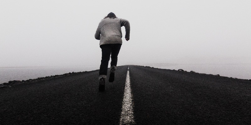 person running up hill